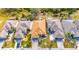 An aerial view of a single-story home with brick driveway and manicured landscaping at 1004 Regal Manor Way, Sun City Center, FL 33573