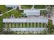 Aerial view of the covered shuffleboard courts, providing residents a place to socialize and play at 1004 Regal Manor Way, Sun City Center, FL 33573