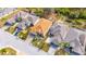 An aerial view of a single-story home with brick driveway and manicured landscaping at 1004 Regal Manor Way, Sun City Center, FL 33573