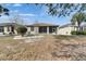 Expansive backyard featuring a screened lanai, perfect for outdoor enjoyment at 1004 Regal Manor Way, Sun City Center, FL 33573