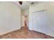 Bedroom showcases tile flooring, a ceiling fan, and a closet at 1004 Regal Manor Way, Sun City Center, FL 33573