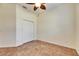 Bedroom with a ceiling fan, tile floors, and a closet at 1004 Regal Manor Way, Sun City Center, FL 33573