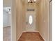 Entryway with a decorative front door, tile flooring, and high ceilings at 1004 Regal Manor Way, Sun City Center, FL 33573