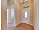 Entryway with a decorative front door, tile flooring, and high ceilings at 1004 Regal Manor Way, Sun City Center, FL 33573