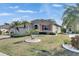 Charming home with a well-manicured lawn, beautiful landscaping, and inviting curb appeal at 1004 Regal Manor Way, Sun City Center, FL 33573