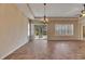 Bright living room featuring tile floors, neutral paint, and a view to the patio at 1004 Regal Manor Way, Sun City Center, FL 33573