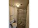 Bright bathroom showcasing a shower with a sliding glass door and tile surround at 10263 Gandy Blvd # 2314, St Petersburg, FL 33702