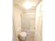 Bright bathroom featuring a toilet, tub, and a sliding glass shower door at 10263 Gandy Blvd # 2314, St Petersburg, FL 33702