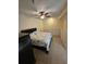 Comfortable bedroom featuring neutral colors and a decorative ceiling fan at 10263 Gandy Blvd # 2314, St Petersburg, FL 33702