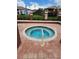 Relaxing hot tub in a community with brick flooring and black metal fencing at 10263 Gandy Blvd # 2314, St Petersburg, FL 33702