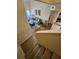 Carpeted stairway leading to a living room with wood floors and a walkout to a balcony at 10263 Gandy Blvd # 2314, St Petersburg, FL 33702