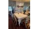 Formal dining room with seating for six and mirrored accent wall at 1050 Starkey Rd # 2503, Largo, FL 33771