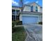 Charming townhome showcasing an attached garage and well-maintained landscaping at 1050 Starkey Rd # 2503, Largo, FL 33771