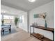 Inviting dining room with wood-look floors, natural light, and stylish table set at 11005 Tyler Dr, Port Richey, FL 34668