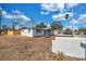 Bright exterior view of a well-maintained home, set against a clear blue sky at 11005 Tyler Dr, Port Richey, FL 34668