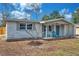 Charming home with a well-manicured front yard, inviting front porch, and freshly painted exterior at 11005 Tyler Dr, Port Richey, FL 34668