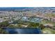 Panoramic aerial shot showing the Sun City Center community, including a lake, golf course, tennis courts, and baseball field at 1228 Caloosa Creek Ct, Sun City Center, FL 33573