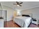 Bedroom features neutral colors, dark wood floors and large windows at 1228 Caloosa Creek Ct, Sun City Center, FL 33573