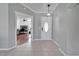 Bright foyer with tile flooring and decorative white door, leading to the main living areas of the home at 1228 Caloosa Creek Ct, Sun City Center, FL 33573