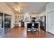 Bright kitchen featuring white cabinets, black appliances, and a center island with bar seating at 1228 Caloosa Creek Ct, Sun City Center, FL 33573