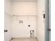 Functional laundry room with hookups and shelving at 12710 Early Run Ln, Riverview, FL 33578