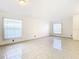 Large living room featuring tile floors and ample natural light at 12710 Early Run Ln, Riverview, FL 33578