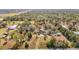 Aerial view of property featuring a home and outbuildings amid lush greenery and open land at 13386 Taylor St, Brooksville, FL 34613