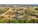 Aerial view of property with a home surrounded by trees and lush landscape at 13386 Taylor St, Brooksville, FL 34613