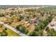 Wide aerial shot of a property with multiple buildings, a mix of trees, and open land at 13386 Taylor St, Brooksville, FL 34613