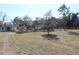 The back yard has a large open space and several trees at 13386 Taylor St, Brooksville, FL 34613