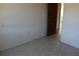 A view of a empty bedroom with plain walls and printed floors at 13386 Taylor St, Brooksville, FL 34613