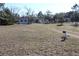 View of a single-story home on a spacious lot with mature trees and a mailbox at 13386 Taylor St, Brooksville, FL 34613