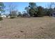 A grassy lot provides an expansive view and the potential for outdoor living at 13386 Taylor St, Brooksville, FL 34613