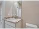 Powder room featuring a granite countertop vanity and a toilet at 16725 Barnwood Pl, Bradenton, FL 34211