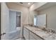 Bathroom with a double sink vanity and granite countertop at 16725 Barnwood Pl, Bradenton, FL 34211