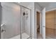 Bathroom showcasing glass enclosed shower with rainfall shower head, and open door to a water closet at 16725 Barnwood Pl, Bradenton, FL 34211