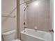 Tiled bathtub and shower with updated shower head at 16725 Barnwood Pl, Bradenton, FL 34211