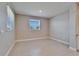 A bedroom with tile floors and two windows, with neutral paint at 16725 Barnwood Pl, Bradenton, FL 34211