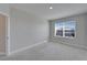 Bedroom with a large window with nice views and neutral carpeting at 16725 Barnwood Pl, Bradenton, FL 34211