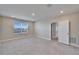 Spacious bedroom featuring plush carpet, recessed lighting, and a bright window at 16725 Barnwood Pl, Bradenton, FL 34211