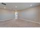 Spacious bedroom featuring plush carpet, base trim, recessed lighting, and an ensuite bathroom at 16725 Barnwood Pl, Bradenton, FL 34211