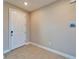 Clean, well-lit foyer with tile flooring and a digital display at 16725 Barnwood Pl, Bradenton, FL 34211