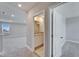 Upstairs hallway leading to a bathroom and bedroom at 16725 Barnwood Pl, Bradenton, FL 34211