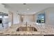 Modern kitchen with granite countertop, stainless steel sink, and bright lighting at 16725 Barnwood Pl, Bradenton, FL 34211