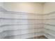 Well-organized walk-in pantry with ample wire shelving for storage at 16725 Barnwood Pl, Bradenton, FL 34211