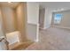 Bright staircase leads to a carpeted open area with natural light streaming through a window at 16725 Barnwood Pl, Bradenton, FL 34211