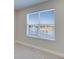 Window view of a scenic lake in a neutral toned room at 16725 Barnwood Pl, Bradenton, FL 34211