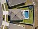 Aerial shot of backyard featuring a private pool, lounge area, and a trampoline at 16733 Glacier Bay Loop, Wimauma, FL 33598