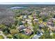 Aerial view of neighborhood, showcasing homes and surrounding landscape at 17112 Downs Dr, Odessa, FL 33556