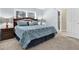 Spacious bedroom with king bed, nightstands and en-suite bathroom access at 17112 Downs Dr, Odessa, FL 33556